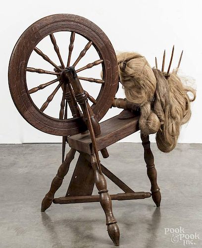 Oak spinning wheel, 19th c., stamped D. Shelly