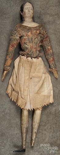 Early composition molded hair doll, 19th c., having a stuffed body with wooden arms and legs, 16'' h.