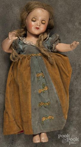 Composition doll, early 20th c., unmarked, with sleep eyes and a composition body, 14 1/2" h.