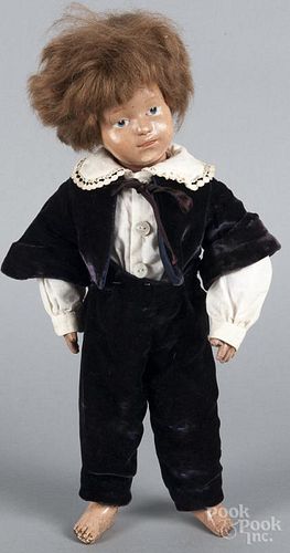 Schoenhut wood boy doll, labeled on body, with painted eyes, a closed mouth, a jointed wood body