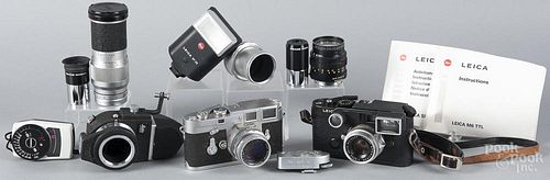 Two Leica cameras, to include a M6 and a M3, together with a Summicron lens, a spare Summilux lens