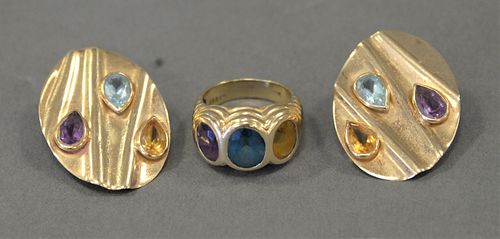 Three Piece 14 Karat Gold Group, pair of earrings and a ring with birth stones, 16.2 grams with stones.