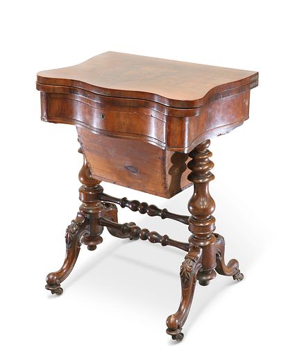 A VICTORIAN WALNUT GAMING AND SEWING TABLE, the foldover to