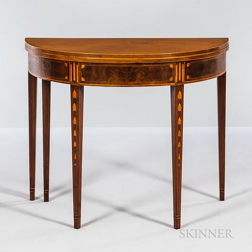 Federal Inlaid Mahogany Demilune Card Table, New York, c. 1795, the top with inlaid edge on a skirt with bookmatched panels bordered by