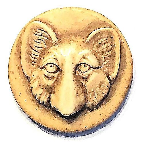 A DIVISION ONE CARVED NATURAL MATERIAL ANIMAL BUTTON