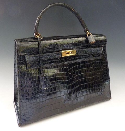 An HermÃ¨s Paris black crocodile skin 'Kelly' bag