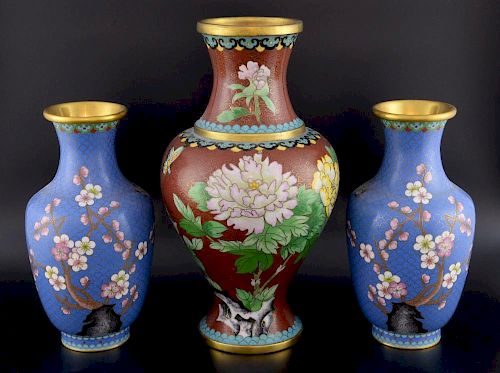 Pair of 20th century Chinese cloisonne vases, the blue ground decorated with a bird and prunus bloss