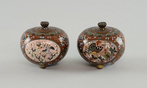 Pair of Chinese cloisonne ovoid pots and covers decorated with panels of birds, each on three feet,