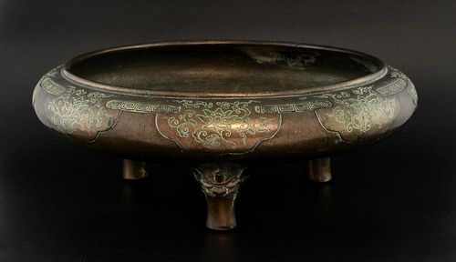 Chinese bronze censer with engraved foliate decoration on grotesque mask feet, 46cm diameter,