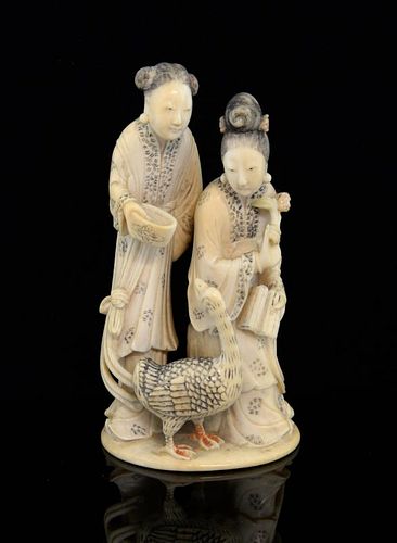 19th century Chinese carved ivory figural group of two ladies holding objects, one seated, the other