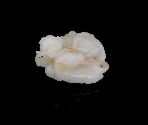 Chinese white jade carving of a mother dog and her pup, their front paws and tails entwined, 5cm lon
