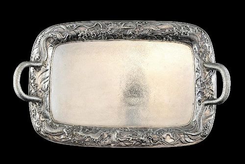 Japanese Meiji period silver twin-handled tray with moulded dragon decoration, the handles formed fr