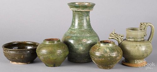 Two Chinese Han dynasty jars, together with three latter pottery vessels