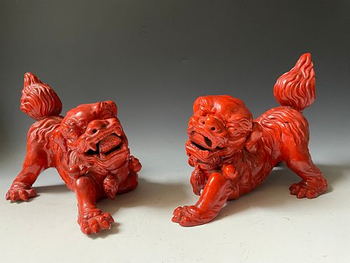 A Pair of Red Glazed Porcelain Lion Foodog