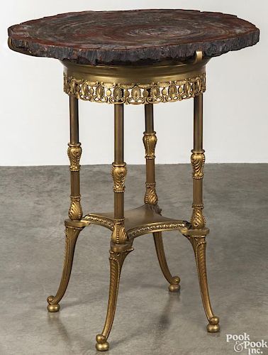 Petrified wood side table, 20th c., with a gilt metal base, 33'' h., 28'' w.
