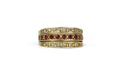 A 9ct gold ruby and sapphire 'night and day' eternity ring,