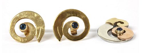 A pair of 9ct gold sapphire set swirl earrings, by Harry Orkin,