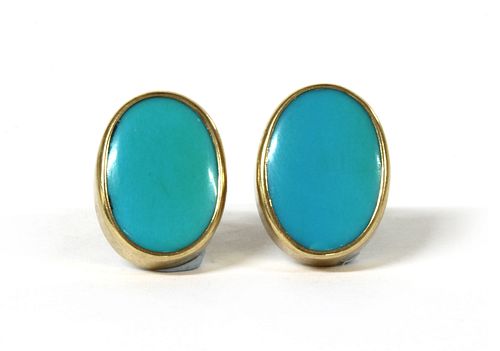 A pair of gold turquoise earrings,