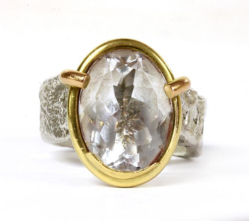 A sterling silver and 18ct gold single stone ring, by Shelley Thomas,