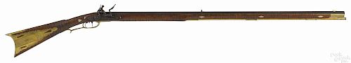Contemporary made flintlock full stock rifle, approximately .45 caliber, with a tiger maple stock