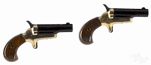 Boxed set of two Butler derringer pistols, .22 short caliber, with brass frames