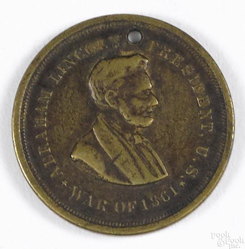 Civil War soldier's identification token with a bust of Abraham Lincoln, inscribed on verso
