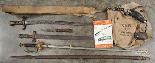 Assorted edged weapons, to include knives and an iron pike, together with a U.S. Navy gas mask bag