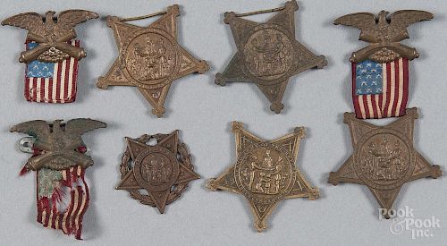Three G.A.R. Civil War badges, late 19th c., 3 1/4'' h., together with two medals.