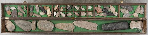 Native American points and stones in a fitted box, together with a painted bow and arrow point.