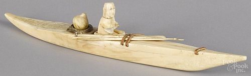 Inuit carved bone kayak, early 20th c., 16'' l.