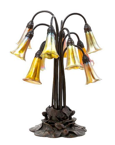 A Tiffany Studios Favrile Glass and Bronze Ten-Light Lily Lamp Height 20 1/4 inches.