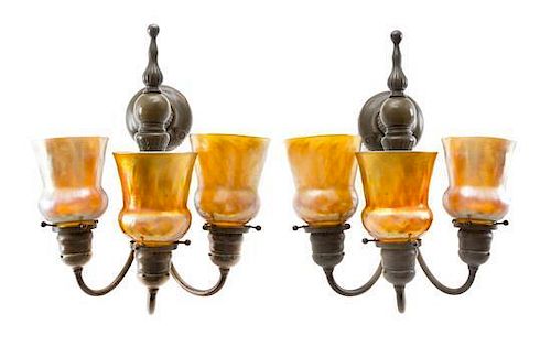A Pair of Tiffany Studios Favrile Glass and Bronze Three-Light Sconces Height of shades 4 1/2 inches, height overall 16 inches.