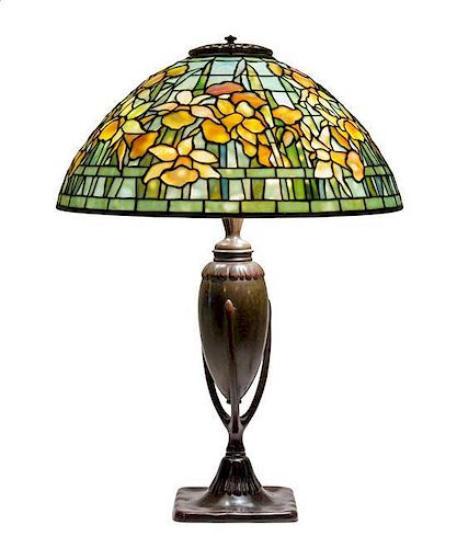 A Tiffany Studios Favrile Glass and Bronze Daffodil Table Lamp Diameter of shade 15 1/4 inches; height overall 21 1/2 inches.