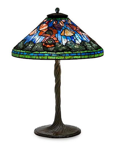 A Tiffany Studios Blue Favrile Glass and Bronze Elaborate Poppy Table Lamp Diameter of shade 20 1/4 inches, height overall 27 1/