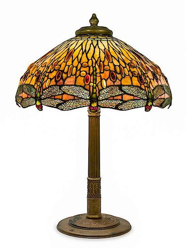 * A Tiffany Studios Favrile Glass and Gilt Bronze Drophead Dragonfly Table Lamp Diameter of shade 22 1/2 inches, height overall