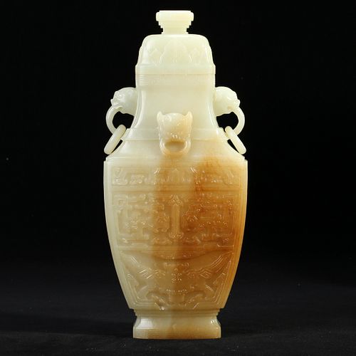 A WHITE JADE VASE AND COVER WITH LOOP HANDLES