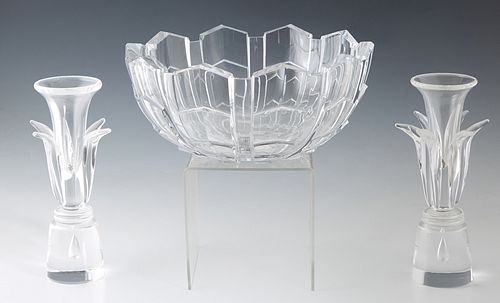 Three Crystal Pieces, consisting of a pair of Steuben candlesticks, 20th c., designed by Donald Pollard in 1962, each having a floriform shaped body, 