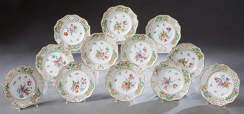 Set of Twelve Dresden Reticulated Porcelain Plates, 20th c., with scalloped edges and gilt and floral decoration, retailed by Bailey, Banks and Biddle