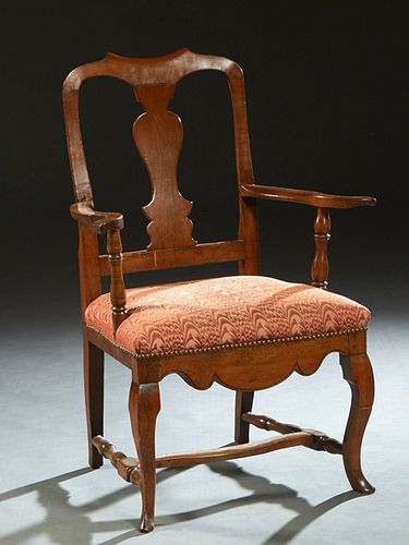 Flemish Carved Mahogany Queen Anne Armchair, 19th c., the canted curved back with a vertical splat, flanked by curved arms, to an upholstered cushione
