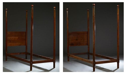 Pair of Carved Oak Poster Convent Beds, early 20th c., the octagonal urn topped posts, joined by a rectangular headboard, to wood rails and foot, H.- 
