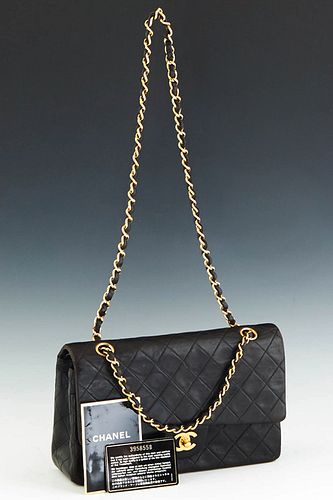 Classic Double Flap Chanel Shoulder Bag, in black quilted lambskin calf leather with gold hardware, opening to a maroon leather lined interior, accomp