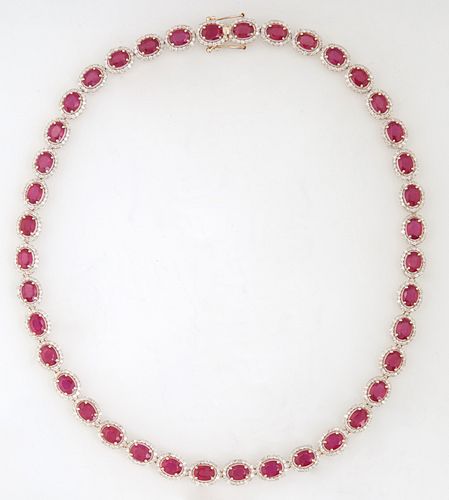 14K Yellow Gold Link Necklace, each of the forty oval links with a graduated oval ruby, atop a border of tiny round white diamonds, total ruby wt.- 43