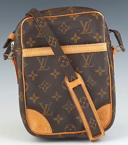 Louis Vuitton Danube Shoulder Bag, in a brown monogram coated canvas, with vachetta leather accents and golden brass hardware, opening to a dark canva