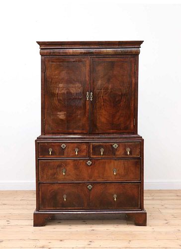 A walnut and feather-banded cabinet on chest,