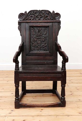 An oak wainscot armchair,