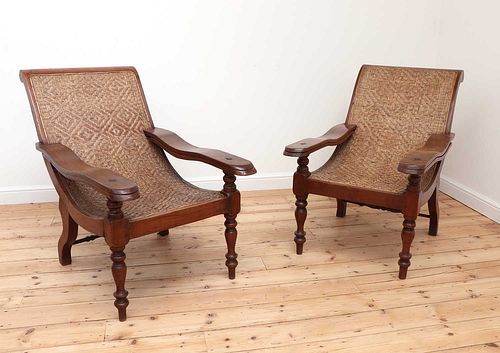 A pair of Indian teak planter's chairs,
