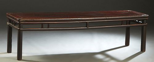Antique Chinese Carved Elm Coffee Table, 19th c., the rectangular top over a spindled skirt, on rounded square legs, H.- 21 1/4 in., W.- 77 in., D.- 2