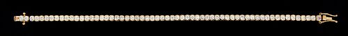 14K Yellow Gold Tennis Bracelet, each of the sixty links with a graduated bezel set round diamond, total diamond wt.- 4.8 cts., L.- 7 in., with apprai