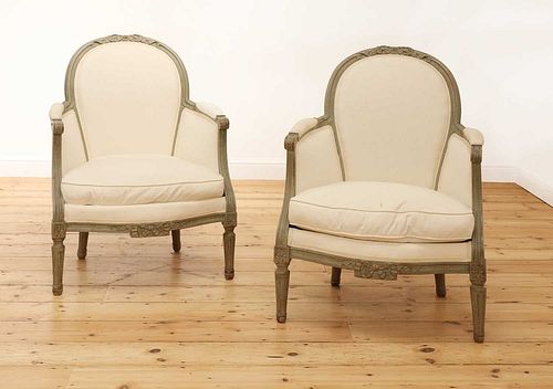 A pair of French Louis XVI-style painted fauteuils,