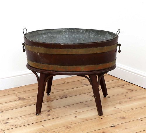 A George III brass-bound mahogany oval wine cooler,